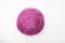 A ball of purple wool for knitting, crocheting isolated on white, violet woolen thread for hobby and DIY