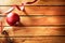 Ball ribbon and pinecone Christmas decoration on wooden table to