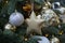 Ball and star hanging on the Christmas tree. Place for text, copy space. Christmas decorations close-up