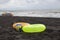 Ball, swimming glasses, tourists, sunbeds, scooter and two Floating Ring on beach