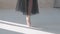 Ballerina in a black transparent skirt shows classic ballet pas. Ballet dancer`s feet as she practices pointe exercises