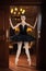 Ballerina in black tutu standing on pointes