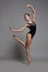 Ballerina dancing in pointe shoes and black leotard