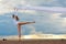 Ballerina dancing at the sea beach.