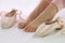 Ballerina feet near pointe shoes isolated