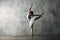 Ballerina female. Young beautiful woman ballet dancer, dressed in professional outfit, pointe shoes and white tutu.