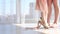 Ballerina helps her daughter walk on toes in pointe