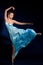 Ballerina jumping, flying in blue dress