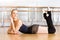 Ballerina lying with her legs up on the floor