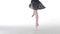 Ballerina performing pirouettes in studio,