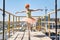 Ballerina posing at concrete balcony