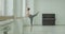 Ballerina practicing attitude in dance studio