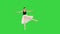 Ballerina in a romantic dudu doing some basic dancing moves on a Green Screen, Chroma Key.