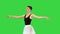 Ballerina in a romantic tutu and pointe ballet shoes training fouette on a Green Screen, Chroma Key.