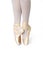 Ballerina`s legs on pointe isolated white background