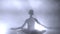 Ballerina`s silhouette turning around. ballerina with hair in a bun is dancing on a scene, against bright light of