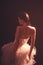 Ballerina. Silhouette photo of a young ballet dancer dressed in a long white dress.