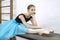 Ballerina sits on table