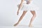 Ballerina white tutu dance exercise performance light background