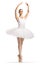 Ballerina in a white tutu dress dancing with arms up
