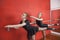 Ballerinas Performing At Barre In Rehearsal Room
