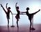 Ballerinas stretching on the bar