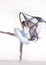 Ballet Dance Ideas. Professional Japanese Female Ballet Dancer Posing in White Tutu With Flying Black Cloth In Hands Against White