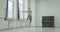 Ballet dancer performing grand jete in dance studio