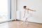 Ballet dancer practice wearing white swan skirt in studio, active lifestyle.