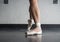 Ballet dancer showing off her pointe shoes standing in classical position