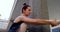 Ballet dancer stretching on pillar 4k