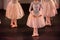 Ballet Dancers with Classical Dresses performing a ballet on Blur Background