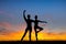 Ballet dancers couple at sunset