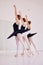 Ballet dancers dancing and practicing in a dance studio together preparing for a performance. Group of elegant, skilled