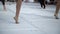 Ballet dancers practicing performance outdoors. Close up of ballerina feet wearing slippers practice moves in ballet class outside