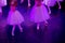 Ballet Dancers under Purple Light with Classical Dresses performing a ballet on Blur Background