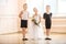 At ballet dancing class: young boys and a girl with flowers