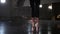 Ballet dancing - woman ballerina in black tutu walks on the tips of pointe shoes