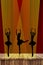 Ballet girls silhouettes of dancing ballerinas on stage in the spotlight with a red curtain background