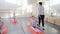 Ballet gymnastic classes, teacher helps girls to practice stretching exercise