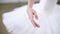 In ballet hall, Young ballerina performs allonge, moving hand elegantly , close-up