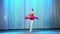 Ballet rehearsal, on the stage of the old theater hall. Young ballerina in red ballet tutu and pointe shoes, dances