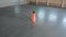 Ballet training indoors. Young beautiful woman ballerina dancing in the pointe shoes holding a strip