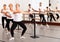 Ballet troupe of different ages in lesson in dance class