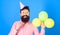 Balloon artist at birthday party. Bearded man entertaining kids at International children day celebration. Smiling man