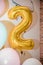 Balloon Bunting for celebration Happy 2 Anniversary made from Gold Number Balloons. Holiday Party Decoration or postcard