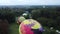 Balloon Festival. Inflating big balloon. Several balloons lie on ground, inflate