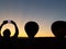 Balloon Festival. Person picturing balloons in the dark blue sky, Adirondack, Queensbury, New York