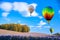 Balloon flies over a field of flowers