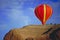 Balloon flying over Red Rock, New Mexico